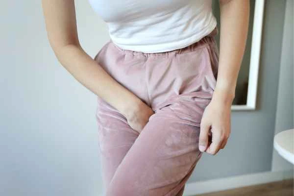 woman running for the toilet because of urinary incontinence West Midlands